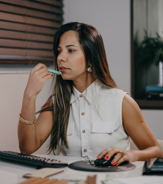 woman checking here computer thinking about the cost of LASIK