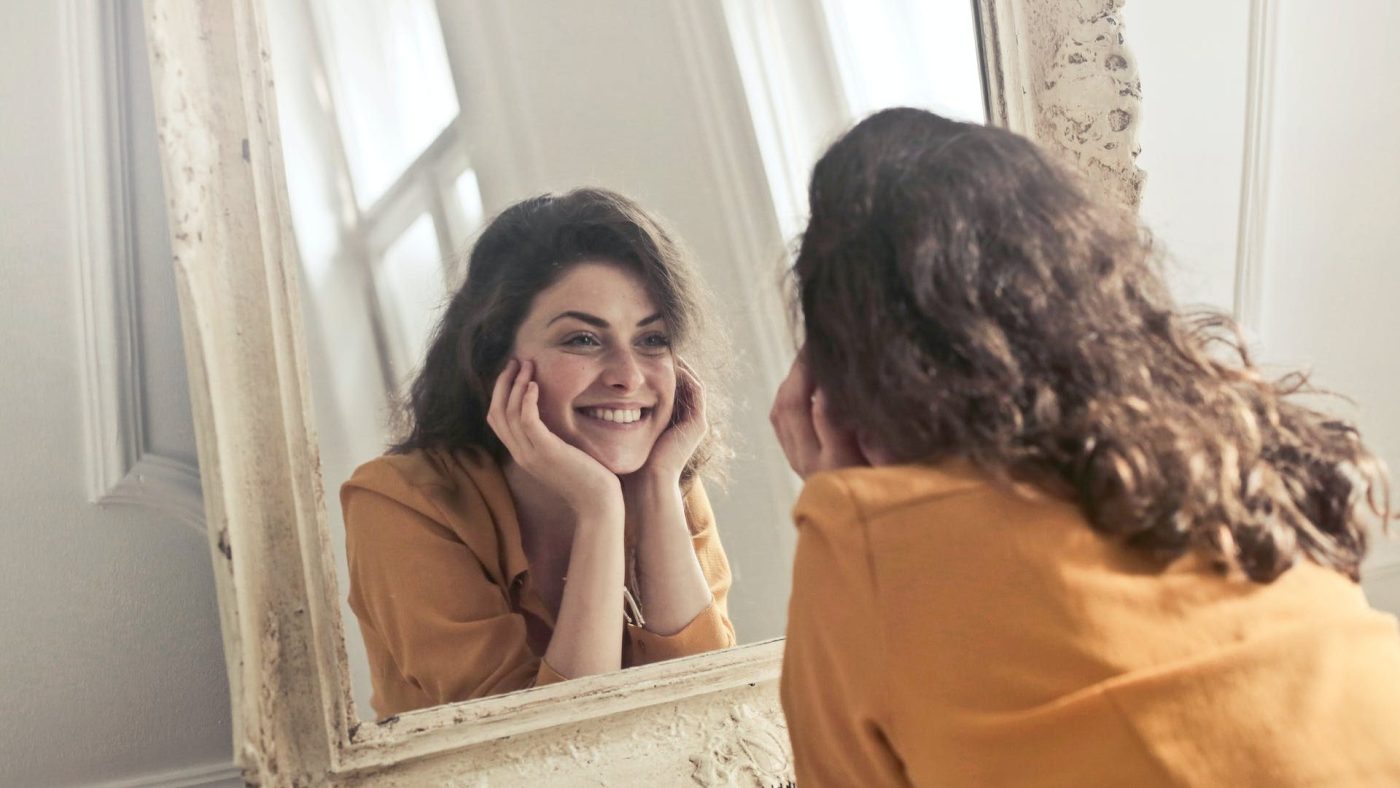 happy LVI patient who can't stop looking at her beautiful eyes in the mirror